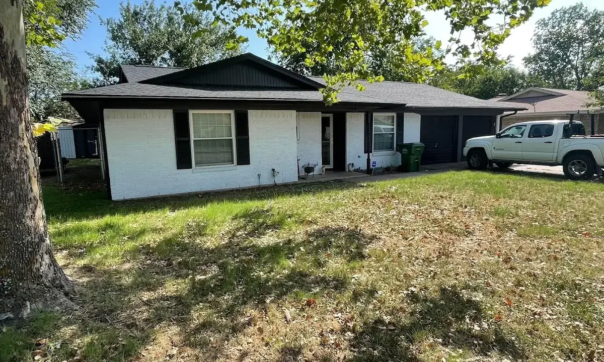 Professional roofing crew working on a residential roof in Hornsby Bend